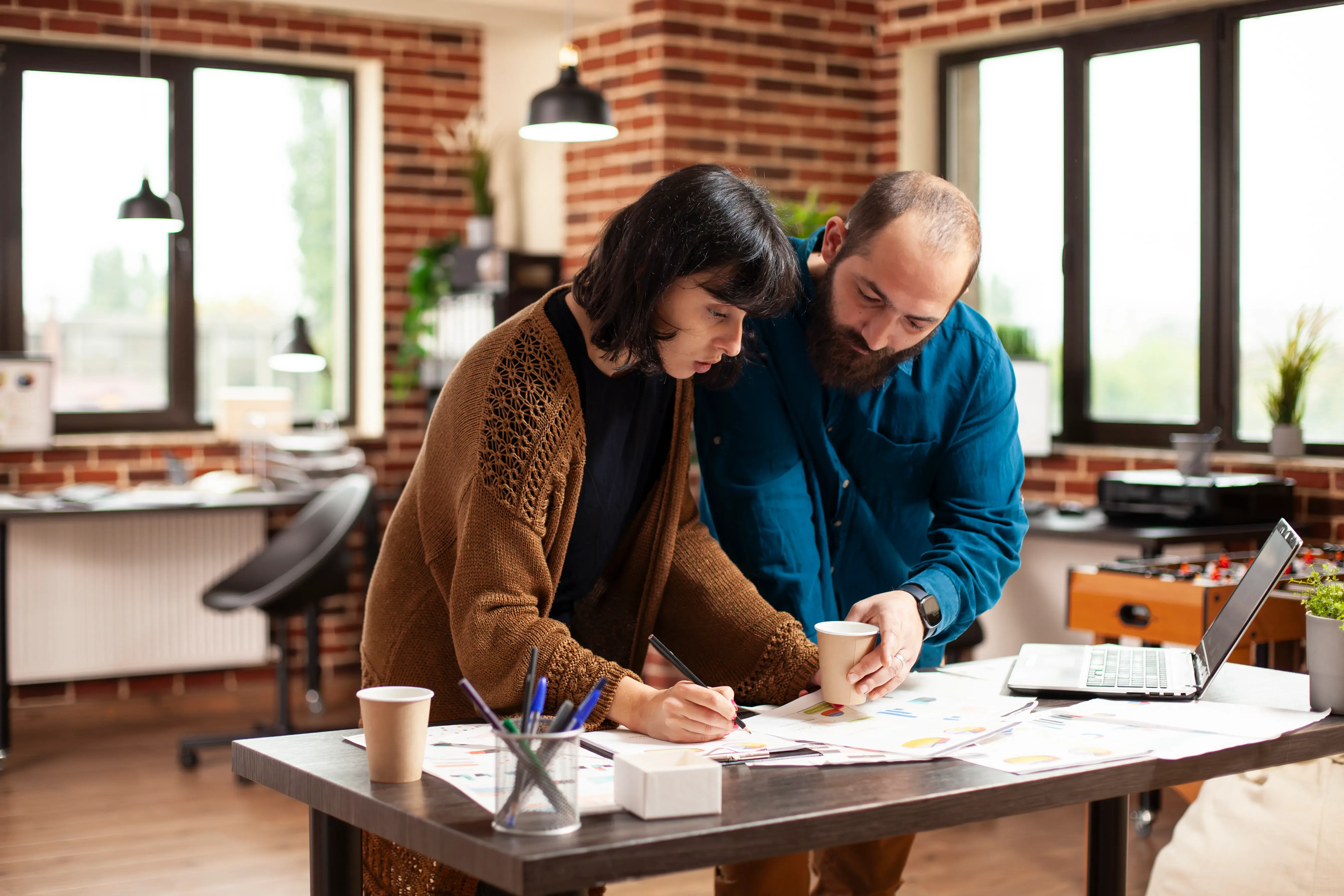 man-woman-review-documents-office